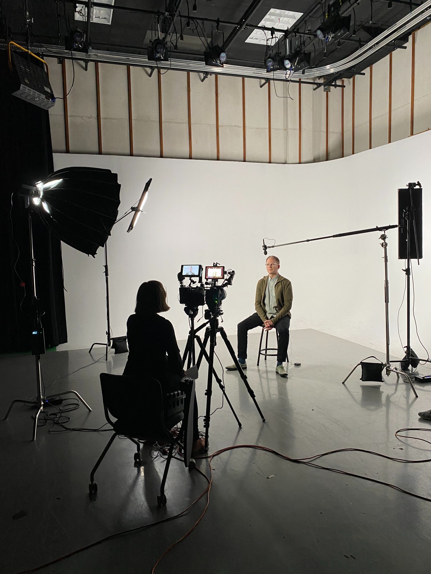 man in a studio being interviewed