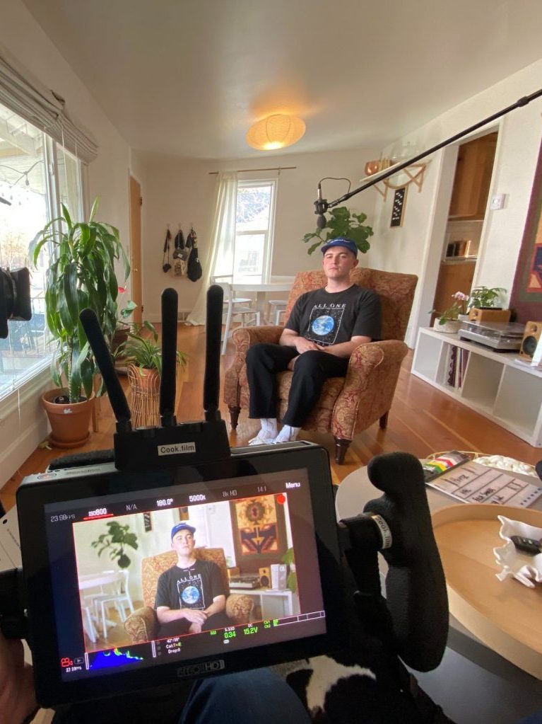 man in a house being interviewed